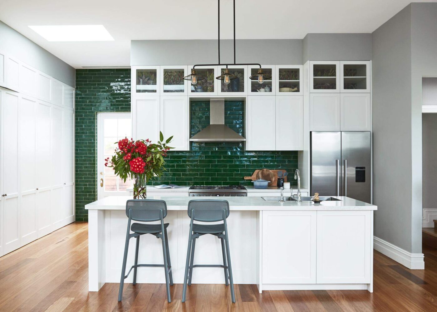 Bespoke kitchen with green and timber floor by Denby Dowling Interior Design